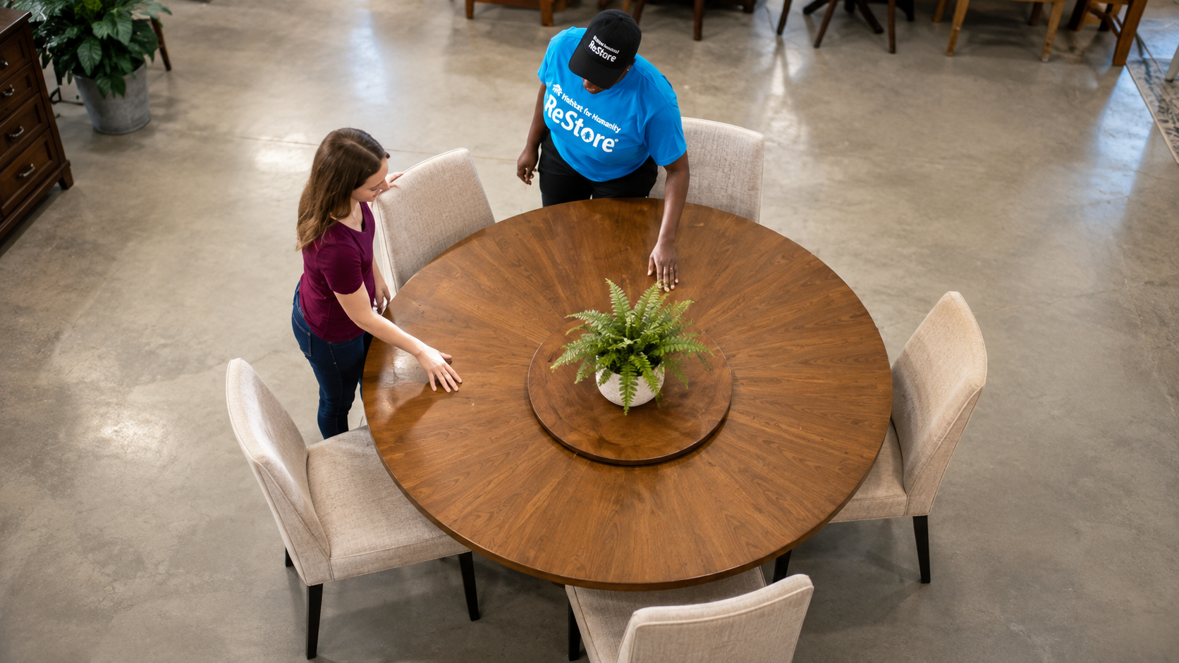 ReStore team member helping a customer with furniture